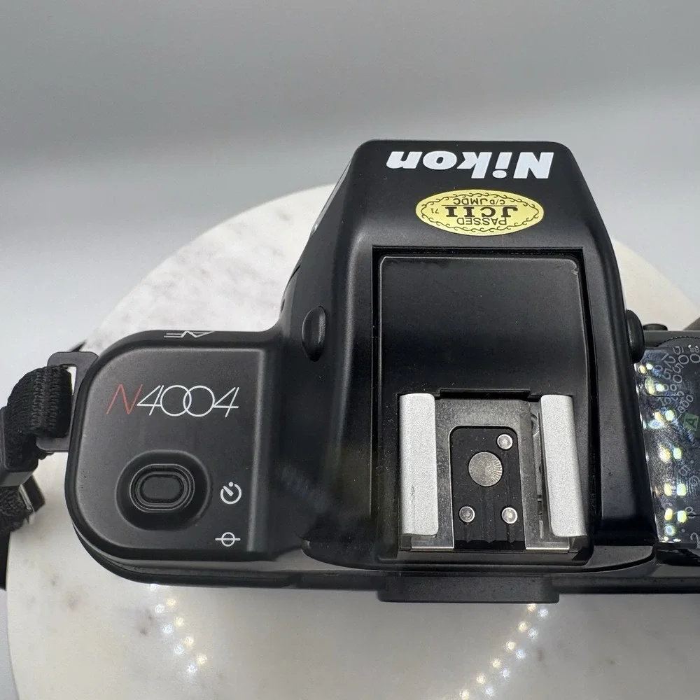 Vintage Nikon N4004 AF 35mm SLR Film Camera Body Only W/ Manuals Bag Powers On